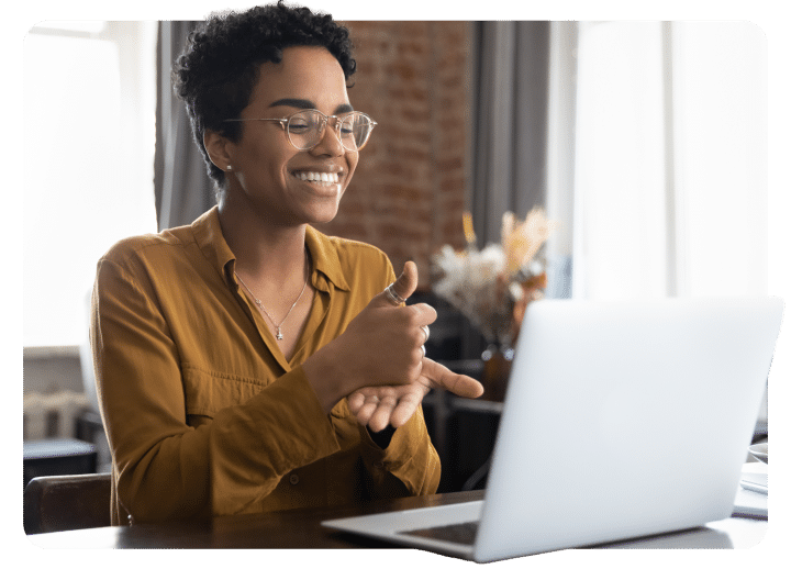 Woman speaking in sign language during an online call.